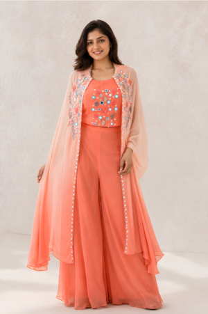 Peach shrug set in chinon crepe with mirror work embroidered jacket by Mansa Sarees