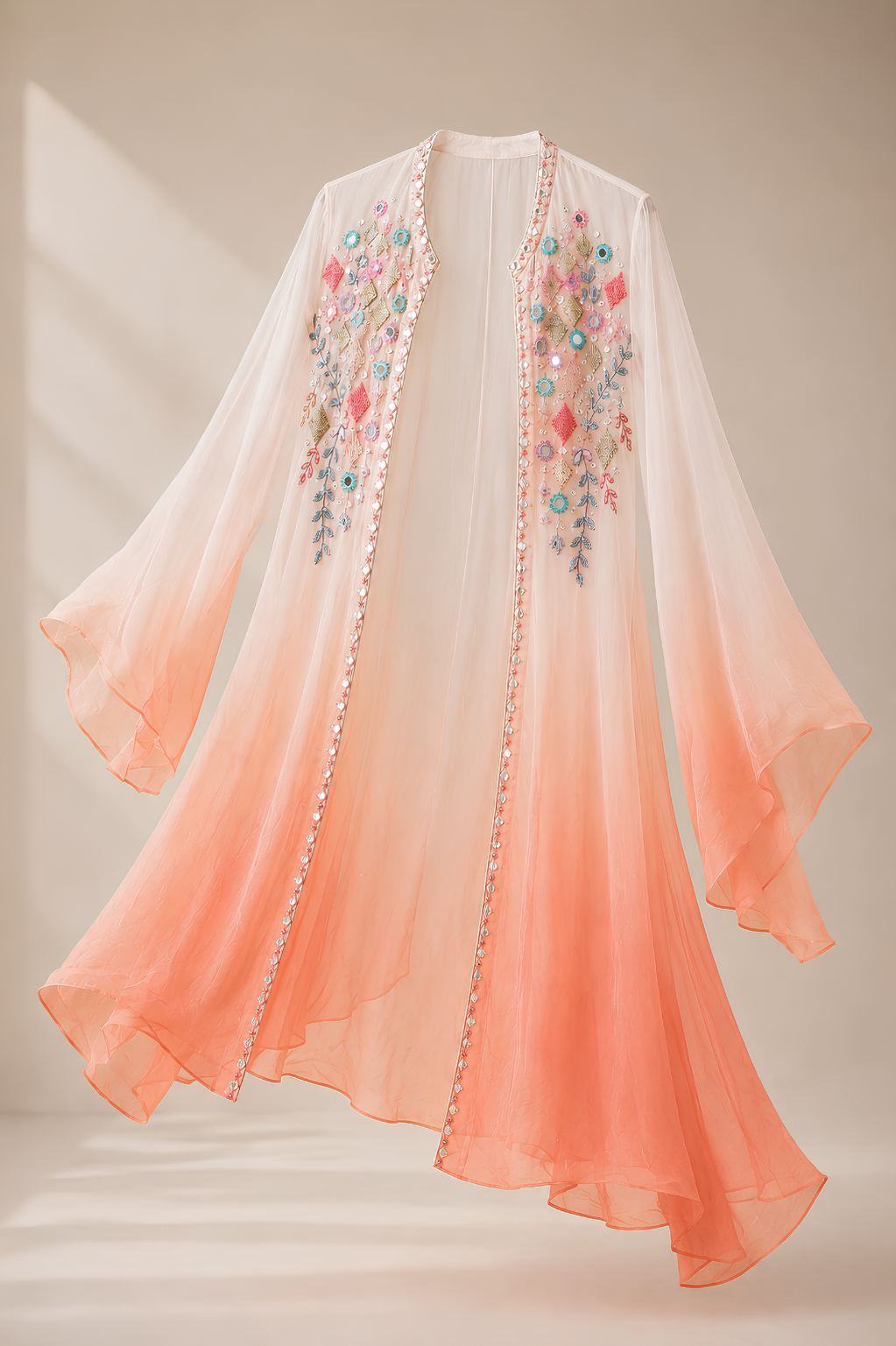 Peach Shrug Set in Chinon Crepe with Mirror & Thread Work Peach embroidered shrug with mirror hand thread work in Chinon crepe from Mansa Sarees