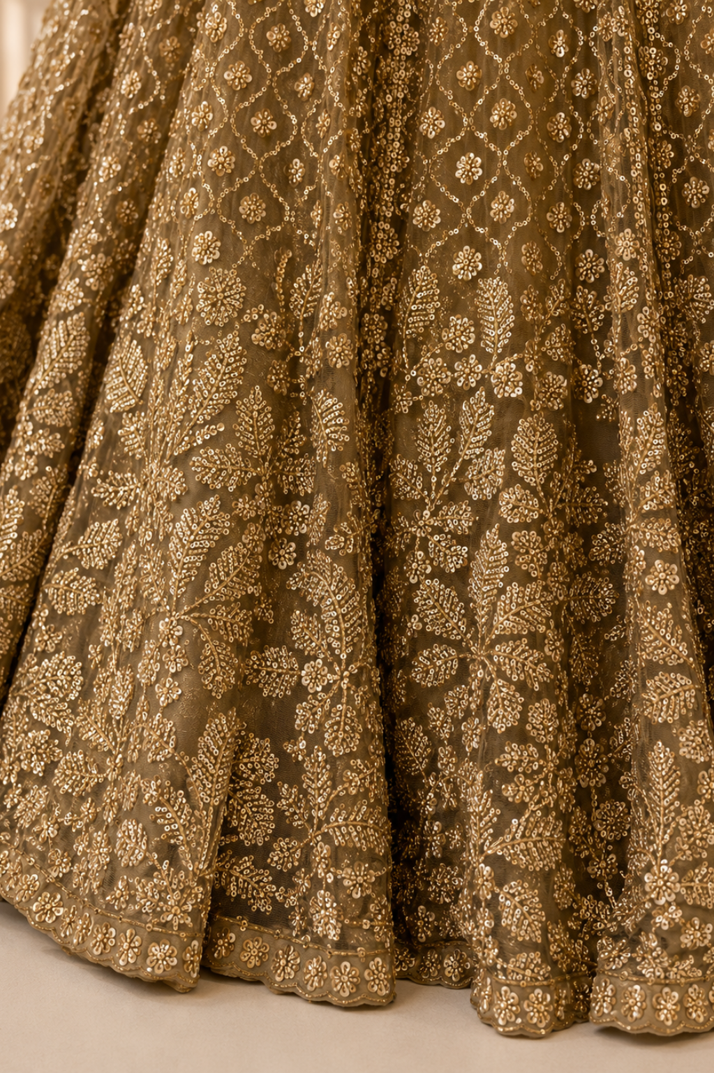 Beige Net Bridal Lehenga with Sequin Cutdana Work Close-up of beige net fabric with dense sequin cutdana embroidery showcasing premium craftsmanship