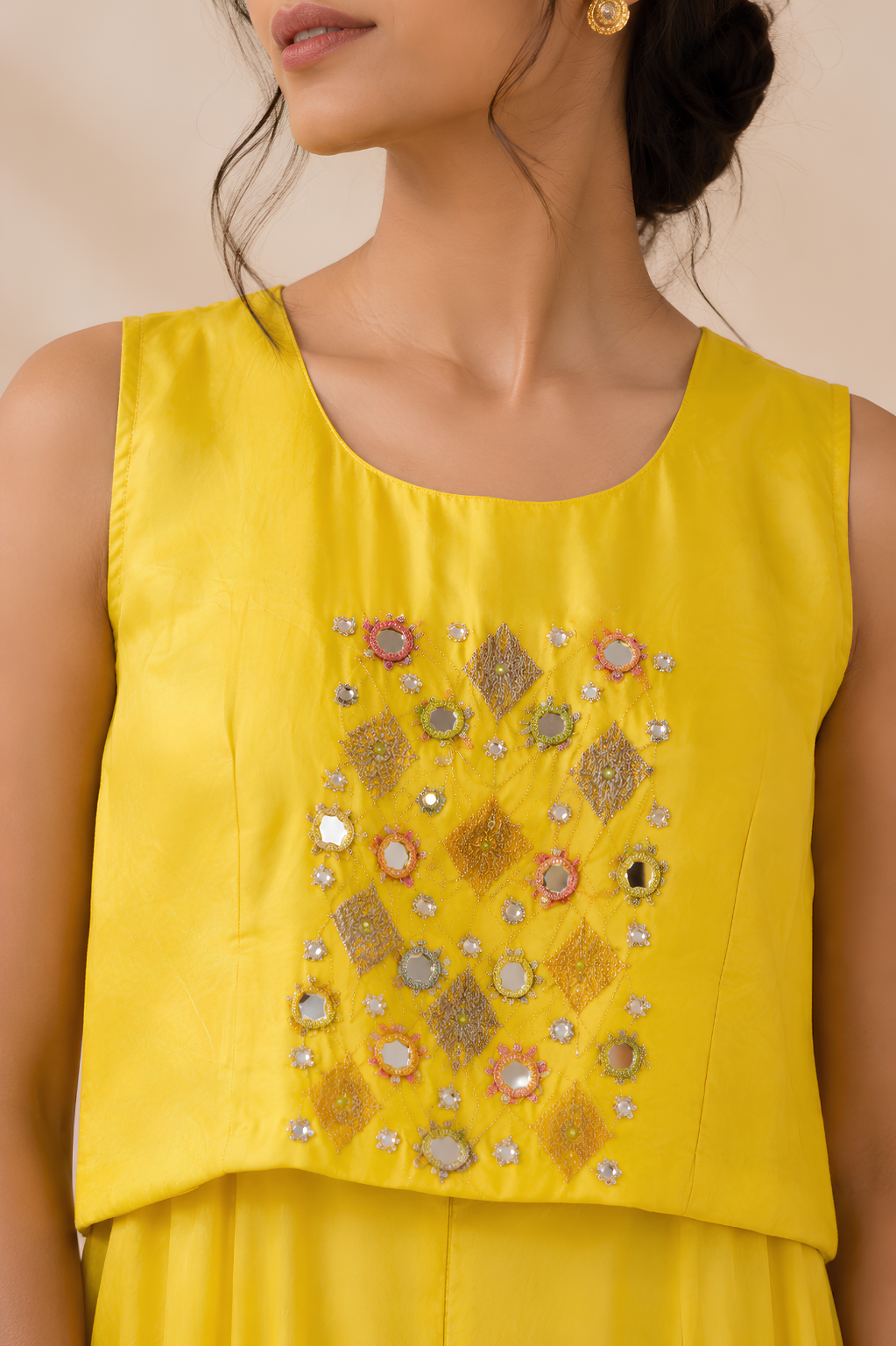 Yellow Shrug Set in Chinon Crepe with Mirror & Thread Work Close-up of mirror, hand and thread embroidery on the yellow Chinon Crepe bodice